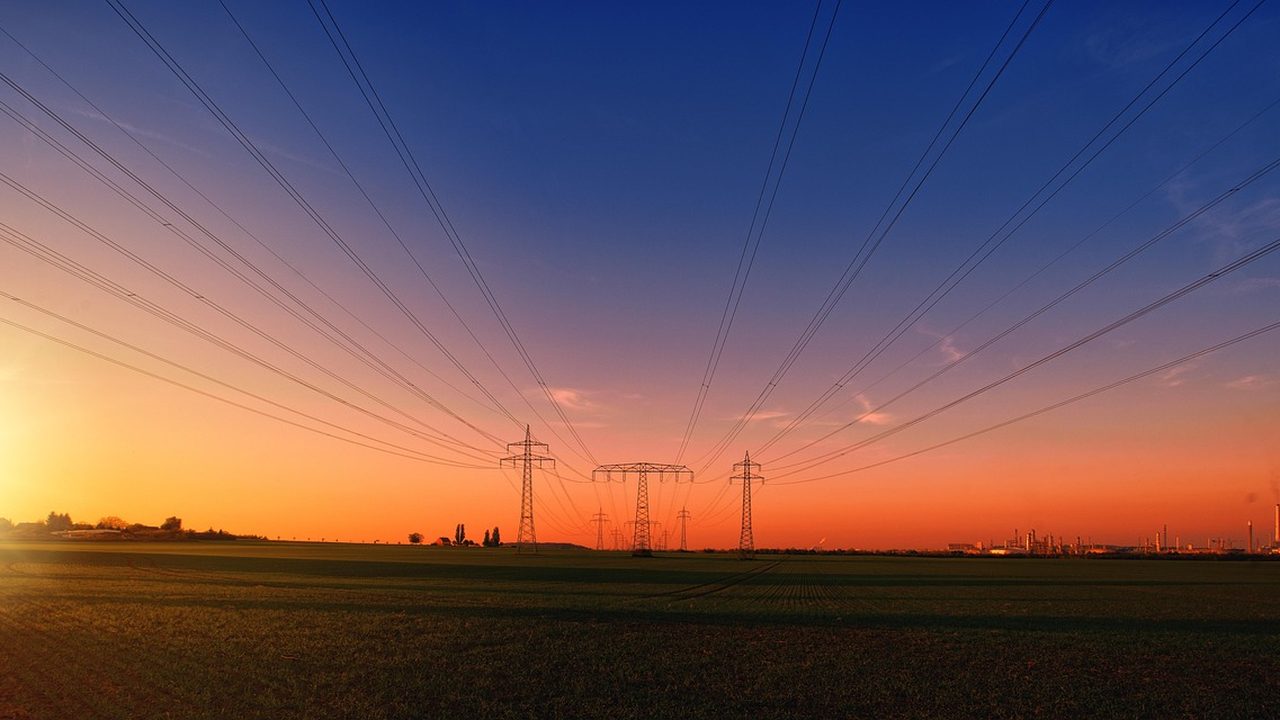 Electricity pylons and power lines at dusk